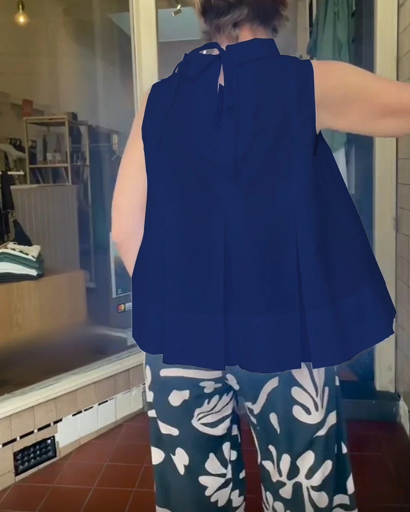 Sana – Blusa lisa sin mangas de estilo minimalista y chic - Imagen 4