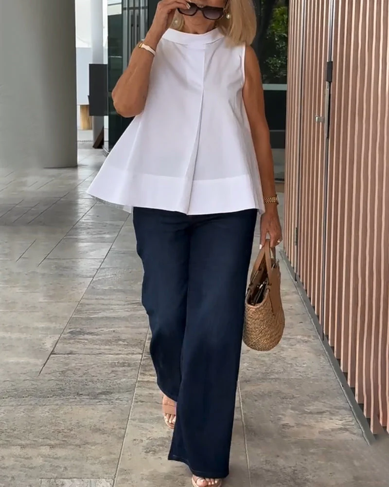 Sana – Blusa lisa sin mangas de estilo minimalista y chic - Imagen 2